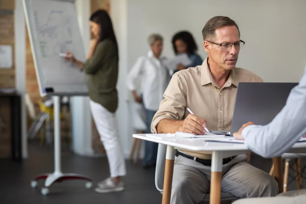 people-using-digital-device-while-meeting
